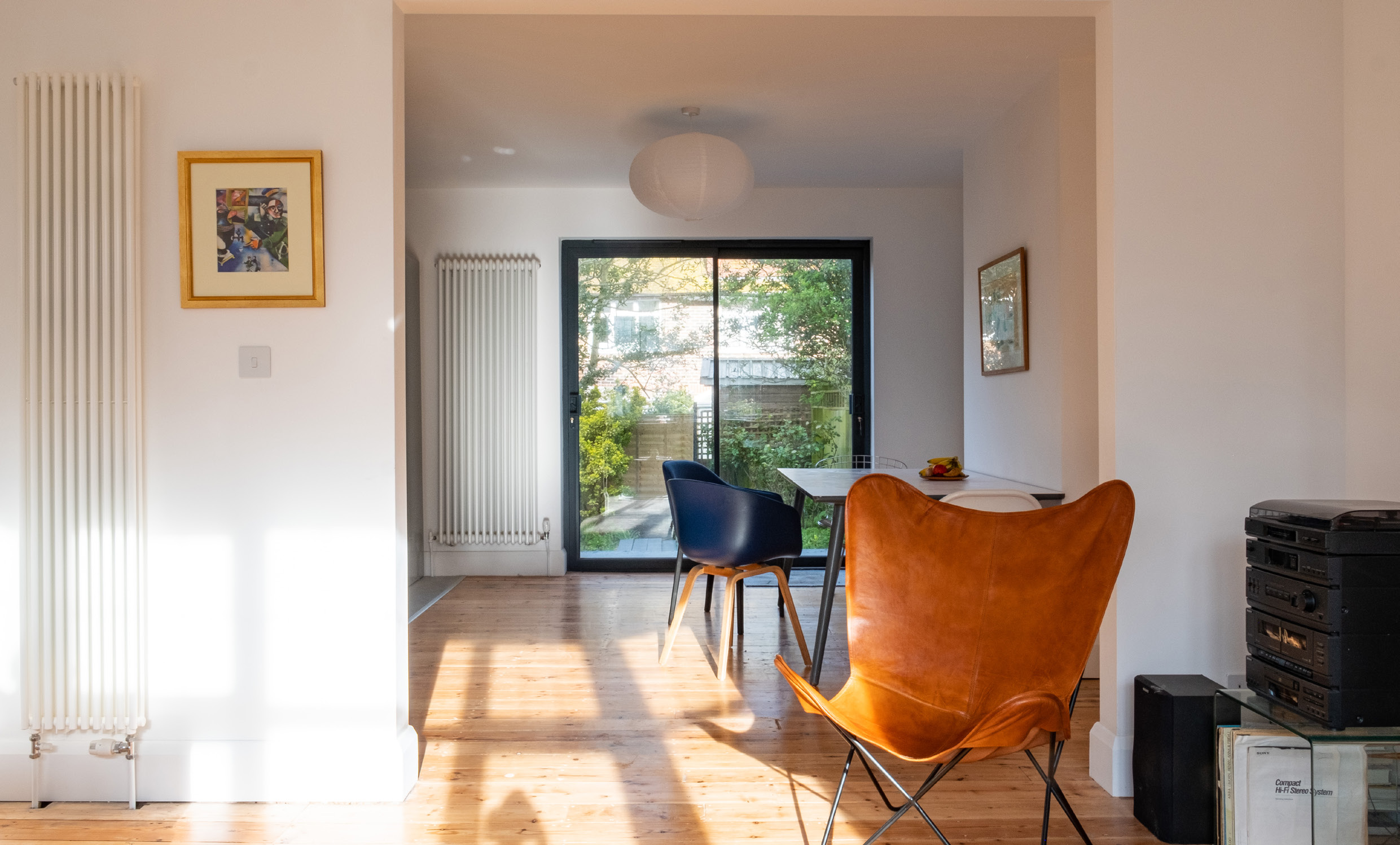 Open-plan living and dining room leading to the garden
